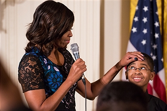 First Lady Michelle Obama addresses guests on stage with youth from the Sphinx Organization, who performed at the 2016 National Arts and Humanities Youth Program (NAHYP) Awards ceremony in the East Room of the White House, in Washington DC, on 15 November 2016. Photo by Cheriss May/NurPhoto.