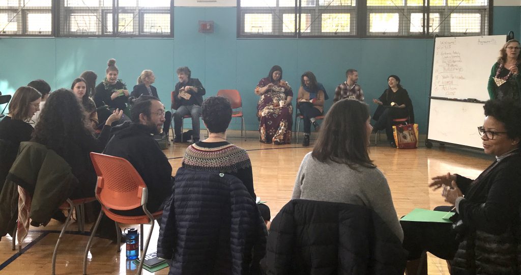 Participants seated in a circle at a BEST Initiative training