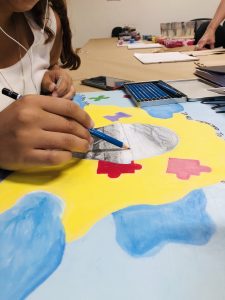 Woman making a 2D art work at the Care Center in Holyoke. Photo: Käthe Swaback.